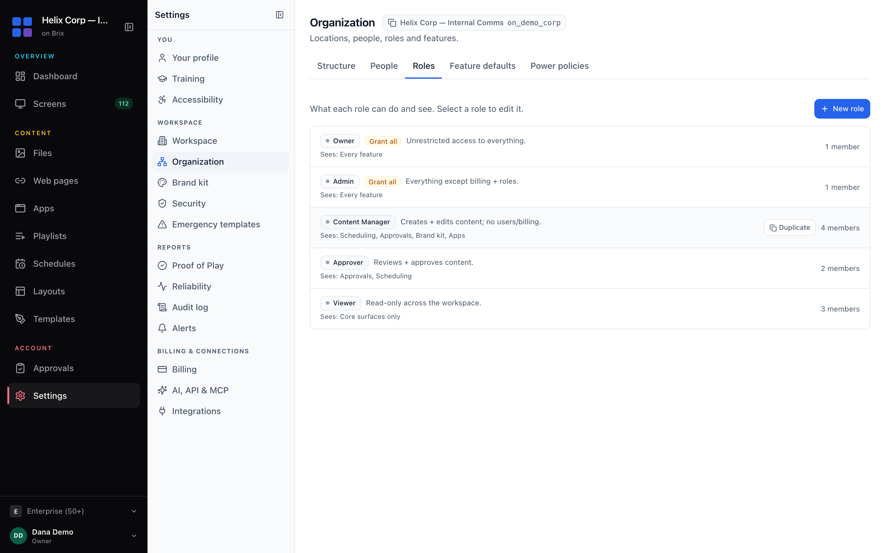 The Roles tab, with the New role button and one card per role showing its description, member count and the features it sees.